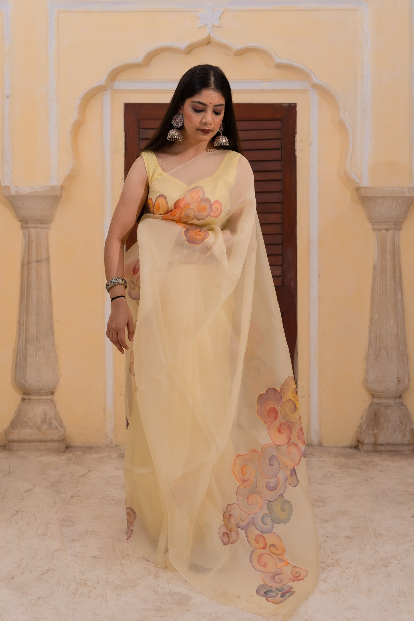 Float through the day in this cheerful yellow saree adorned with vibrant clouds ☁️💛