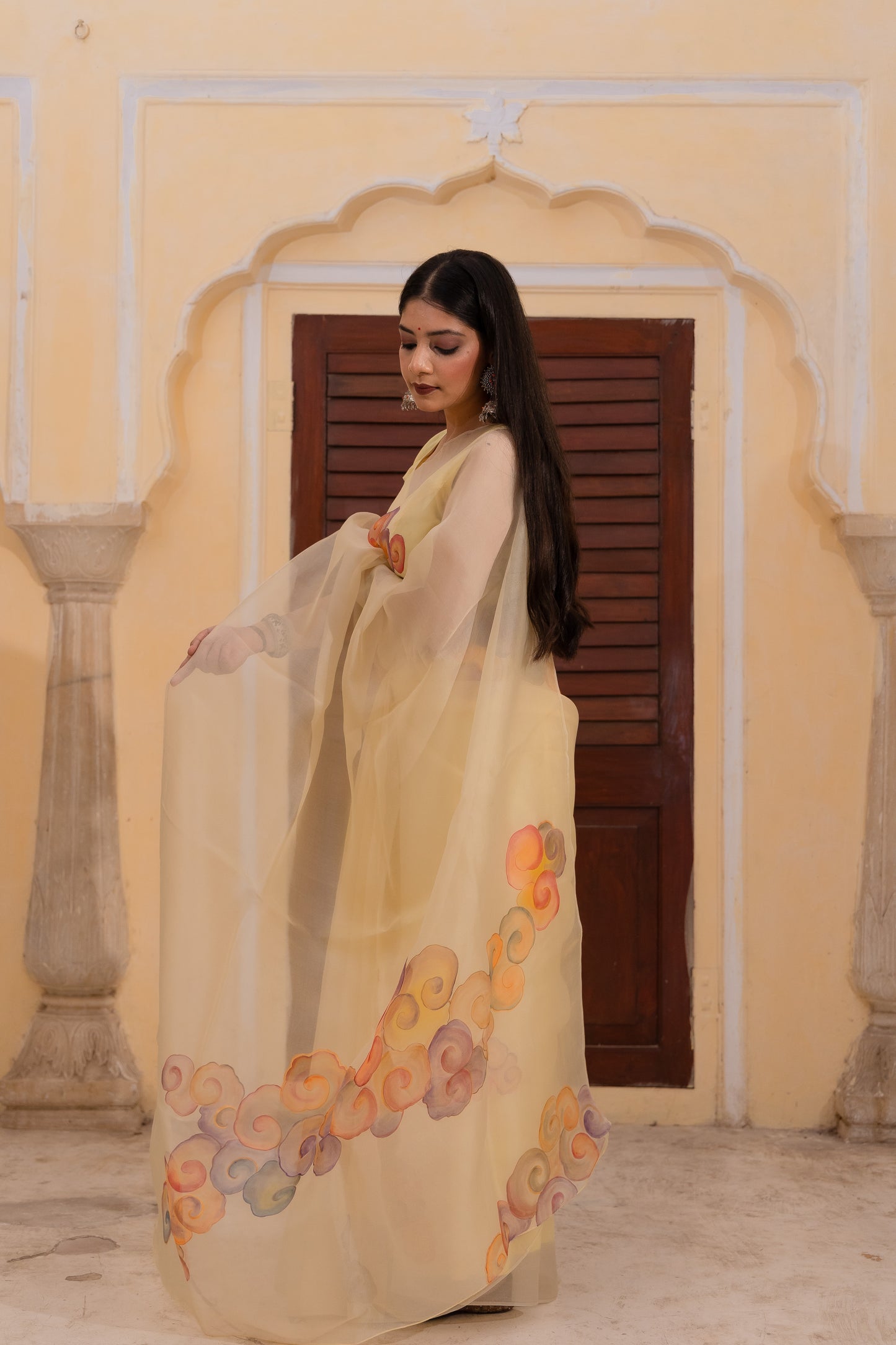 Float through the day in this cheerful yellow saree adorned with vibrant clouds ☁️💛