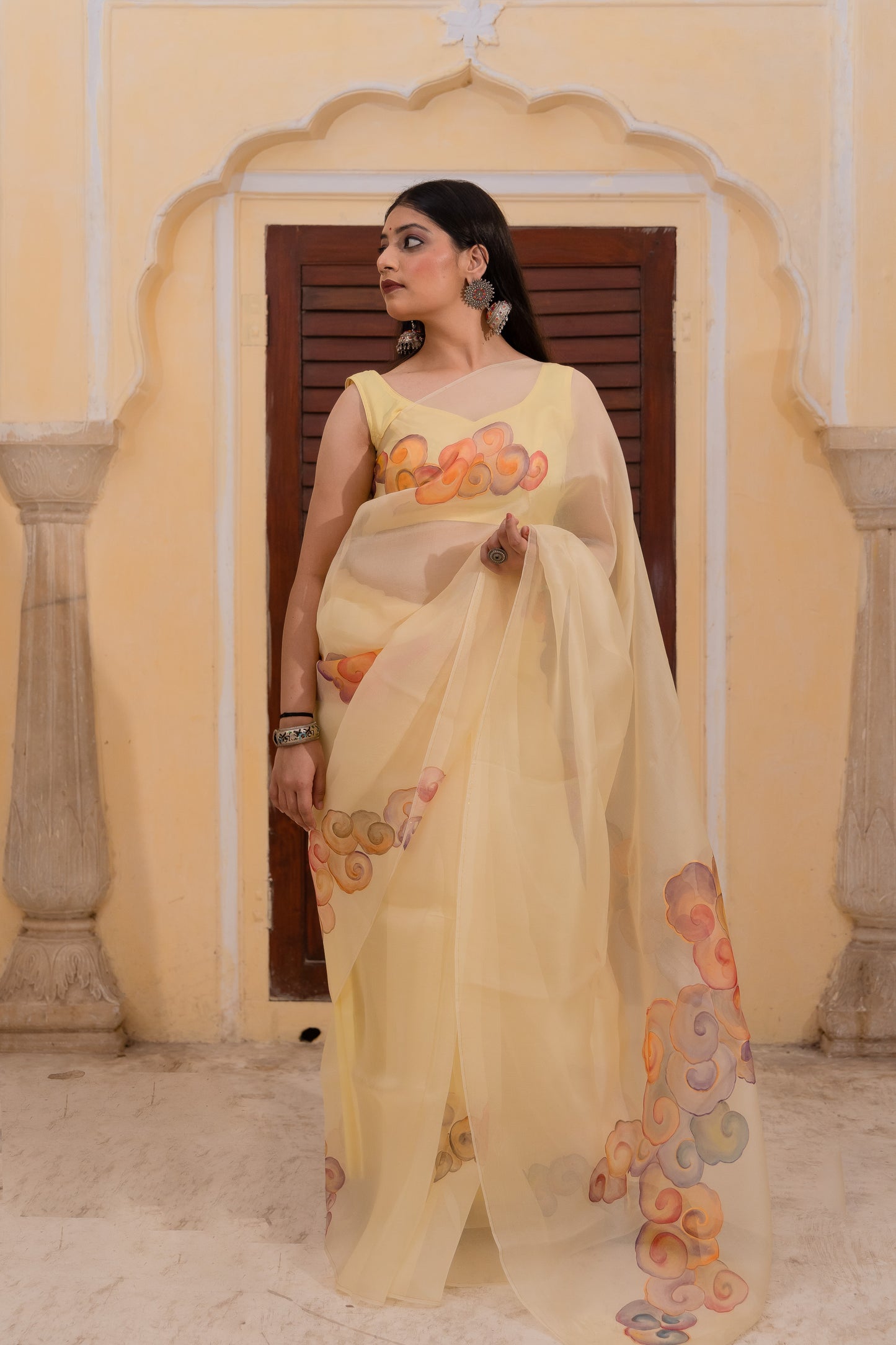 Float through the day in this cheerful yellow saree adorned with vibrant clouds ☁️💛