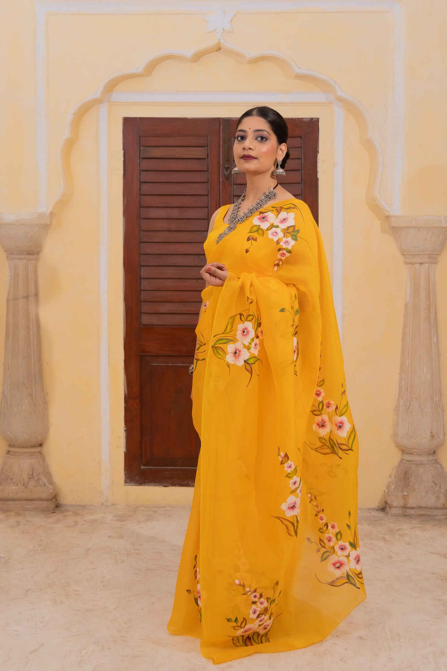 Radiate joy in this mango yellow silk organza saree adorned with vibrant florals 🌼✨ Perfect for brightening any occasion! 💛