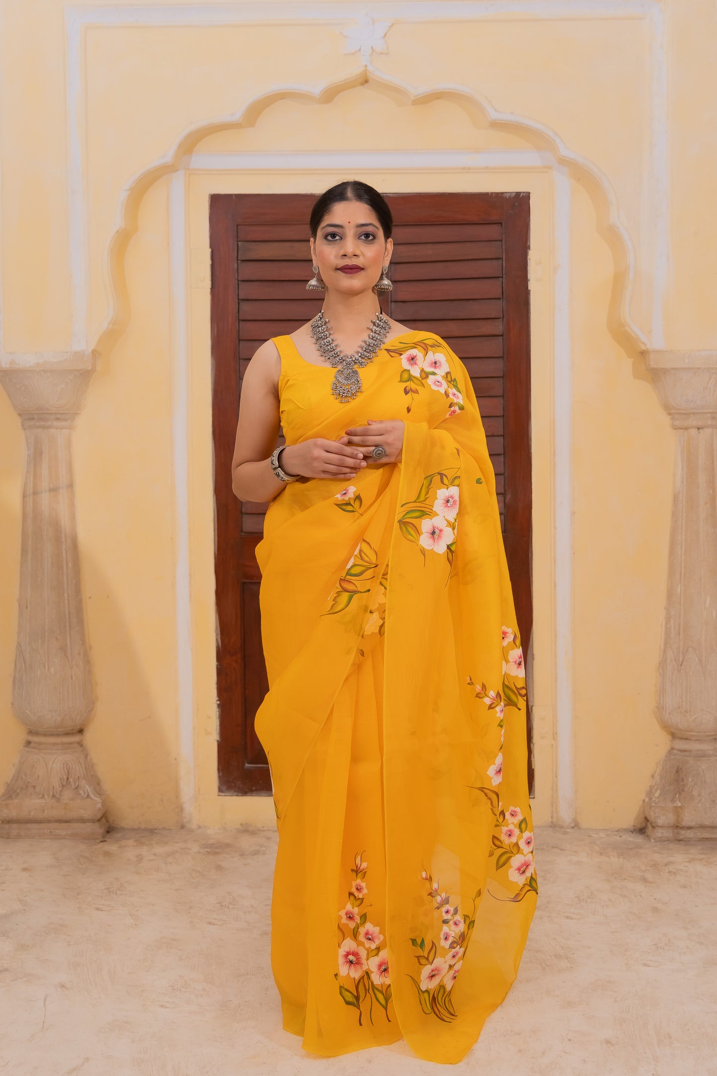 Radiate joy in this mango yellow silk organza saree adorned with vibrant florals 🌼✨ Perfect for brightening any occasion! 💛