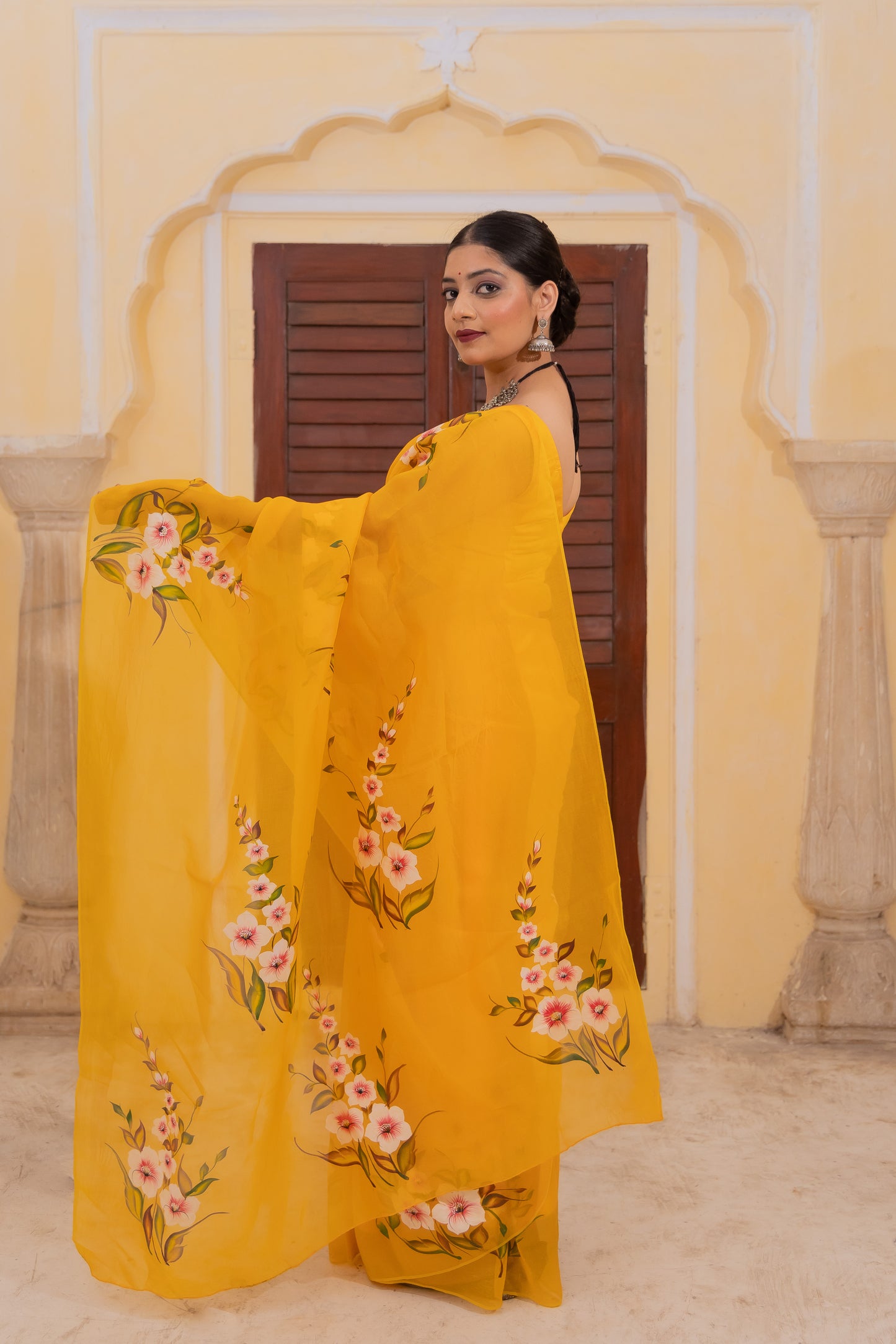 Radiate joy in this mango yellow silk organza saree adorned with vibrant florals 🌼✨ Perfect for brightening any occasion! 💛