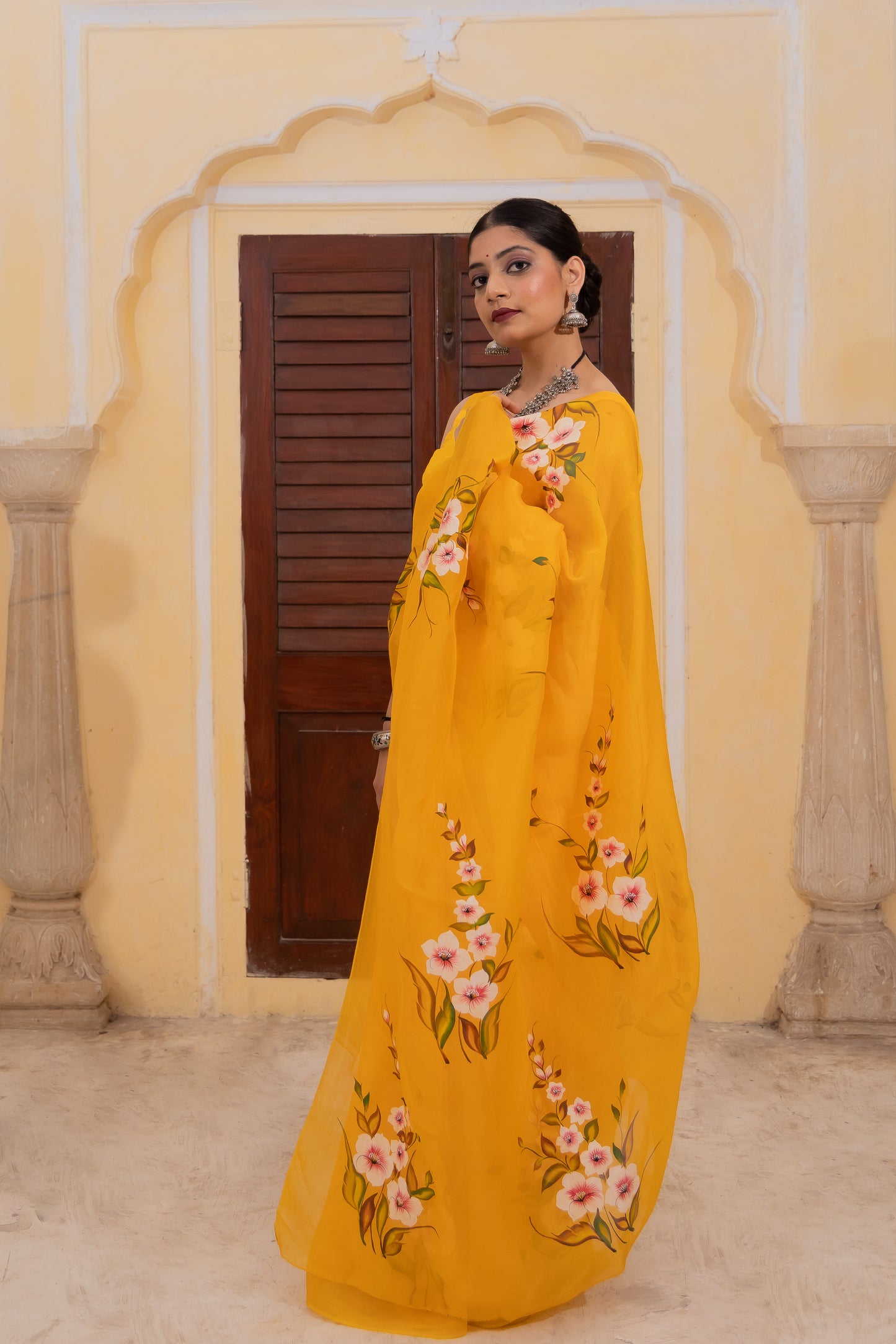 Radiate joy in this mango yellow silk organza saree adorned with vibrant florals 🌼✨ Perfect for brightening any occasion! 💛