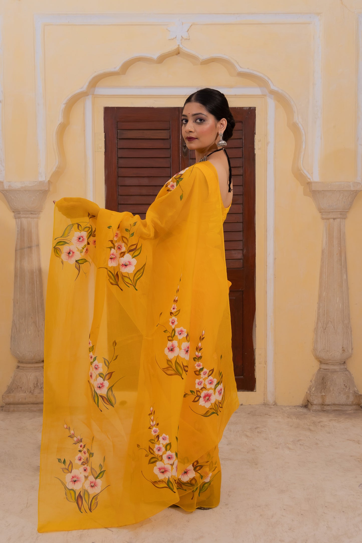 Radiate joy in this mango yellow silk organza saree adorned with vibrant florals 🌼✨ Perfect for brightening any occasion! 💛